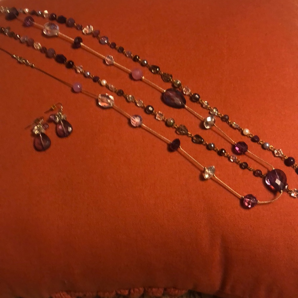 Set of two long necklaces with matching dangle earrings. Purple shades